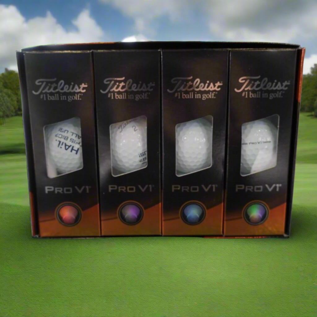 Four Titleist Pro V1 golf balls in packaging on a reflective surface.