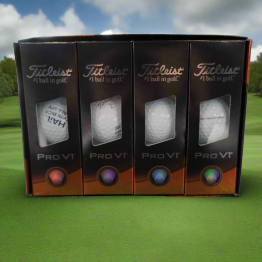 Four Titleist Pro V1 golf balls in packaging on a reflective surface.